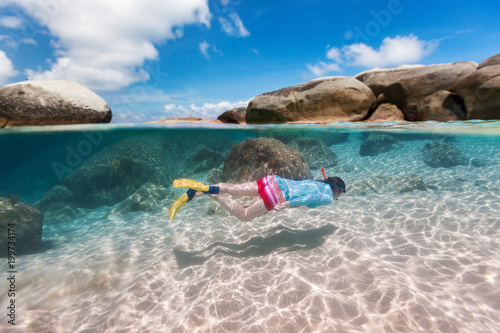 Fototapeta Naklejka Na Ścianę i Meble -  Woman snorkeling in tropical water