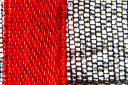 Macro background of red tape and metal fabric