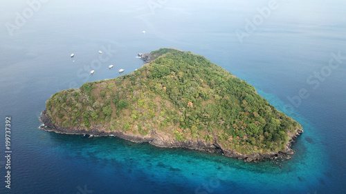 Aerial photo tropical island and ocean with yachts in Thailand