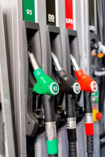 Quadro su tela Colorful Petrol pump filling nozzles , Gas station in a service in daytime