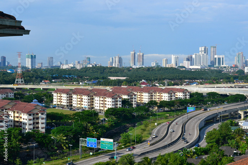 Vászonkép High angle view of Johor Bahru's cityscape with highway and skyline in the after