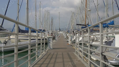 Pontoon and sailboats photo