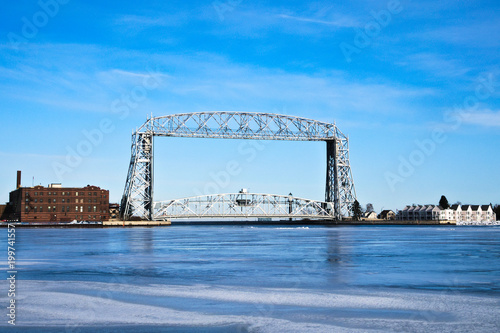 Duluth Minnesota aerial lift bridge with ice on sunny day photo