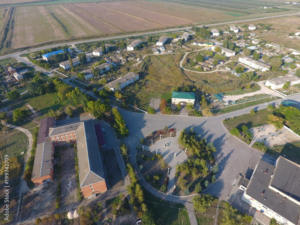 View from the top of the village. Houses and gardens. Countryside, rustic landscape. Aerial photography