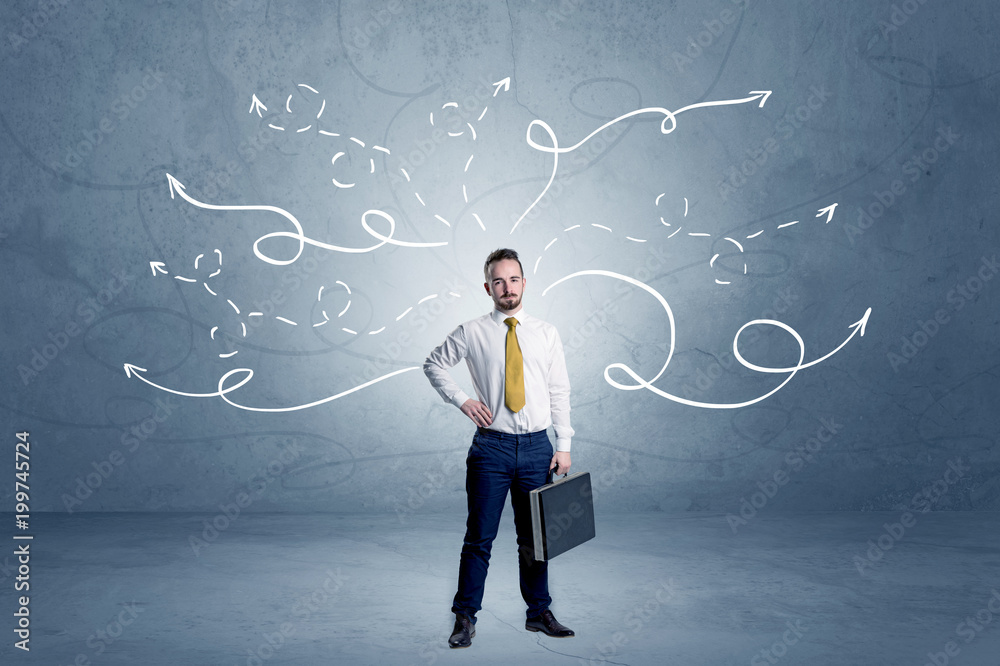 Elegant businessman choosing between directions with winding drawn arrows around
Elegant businessman choosing between directions with winding drawn arrows around