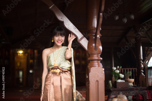 Nice and charming Thai girl with Thai ancient style dressing .