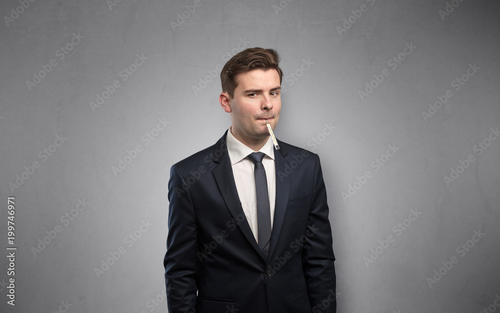 Young tired businessman with thermometer and copy space
Young tired businessman with thermometer and copy space