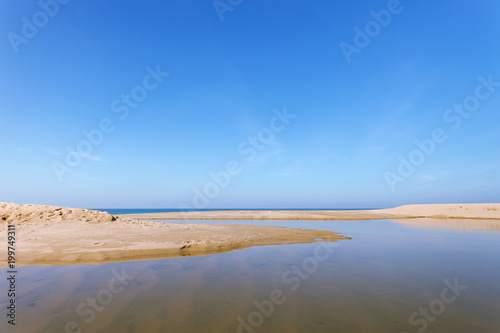 Beautiful tropical sea with white sand on the beach and clear blue sky at phuket thailand image for summer season and travel background.