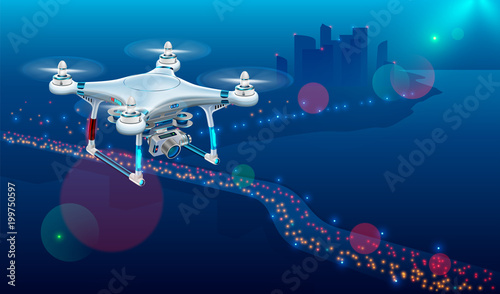 Drone with video camera In The Air Over City Roadway. Unmanned Aircraft System or UAV monitoring street traffic or photography urban landscape in the Night .