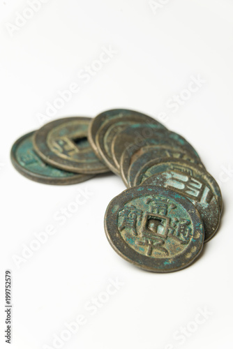 Ancient Chinese bronze coins on white background photo