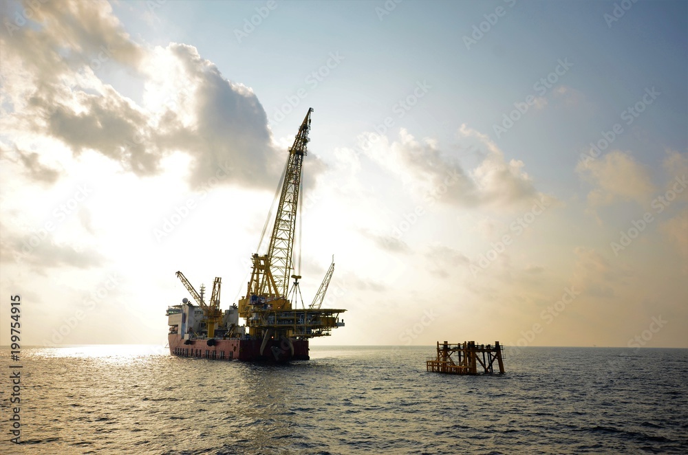 Derrick lay vessel is lifting platform topside to install on existing jacket. Derrick lay vessel is lifting platform topside to install on existing jacket.
