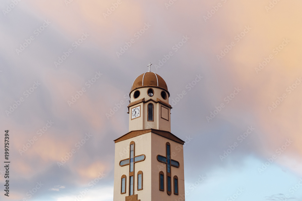 Salento church bell under colorful clouds on a stormy afternoon, Quindio, Colombia Salento church bell under colorful clouds on a stormy afternoon, Quindio, Colombia