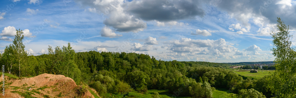 Panorama with beautiful clouds on the blue sky