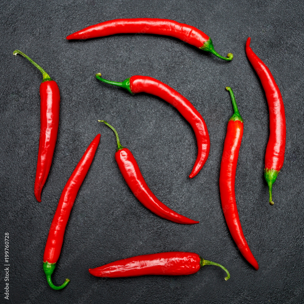 red chili pepper on dark concrete background