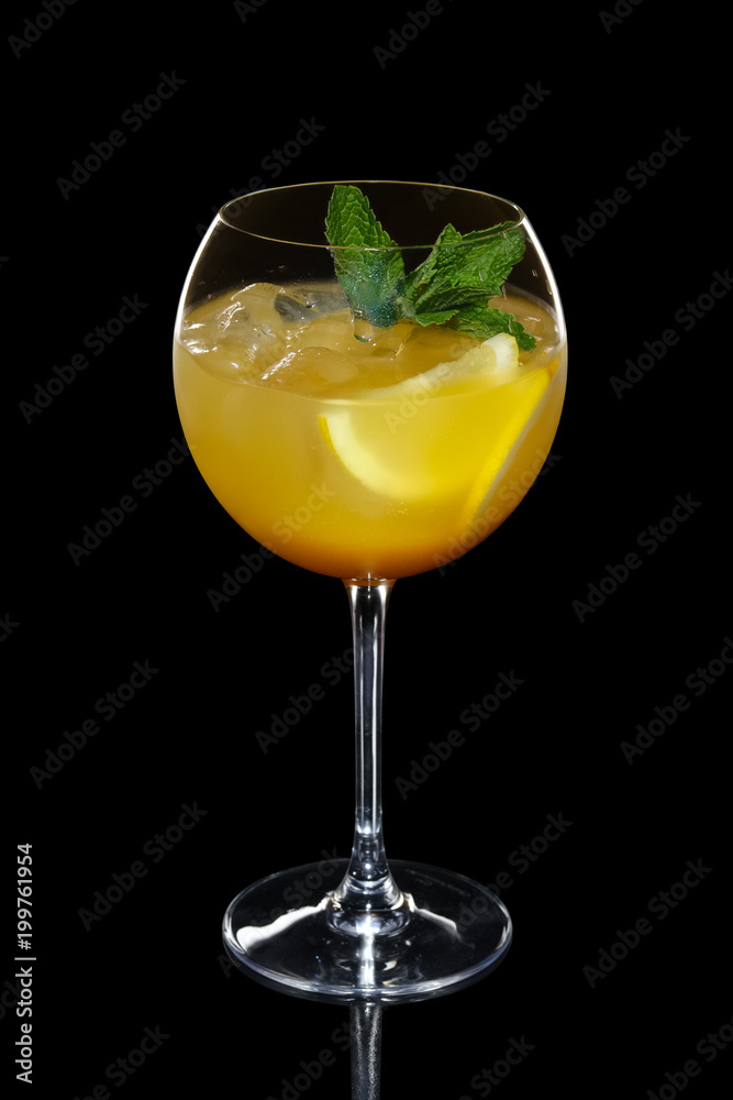 Cild lemon cocktail with a sparkling wine with ice in wine glass isolated on black