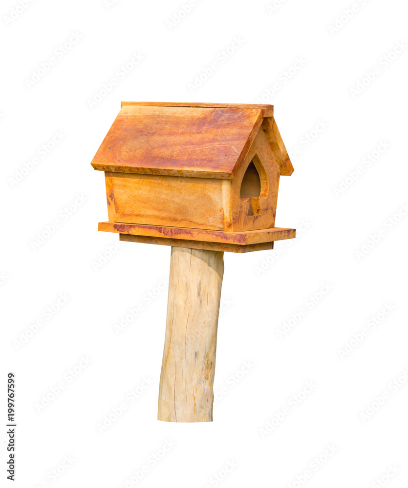 wooden bird house yellow on a pole isolated on a white background with clipping path. wooden bird house yellow on a pole isolated on a white background with clipping path.