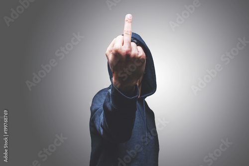 view of a man showing his middle finger hiding his face