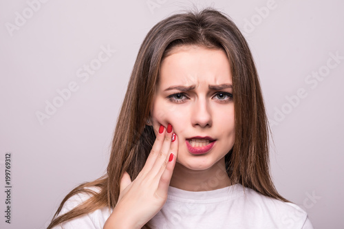 Teeth Problem. Woman Feeling Tooth Pain. Closeup Of A Beautiful Sad Girl Suffering From Strong Tooth Pain. Attractive Female Feeling Painful Toothache. Dental Health And Care Concept.