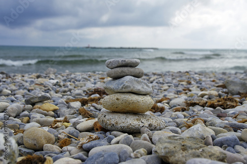 Small zen stone tower on the beach