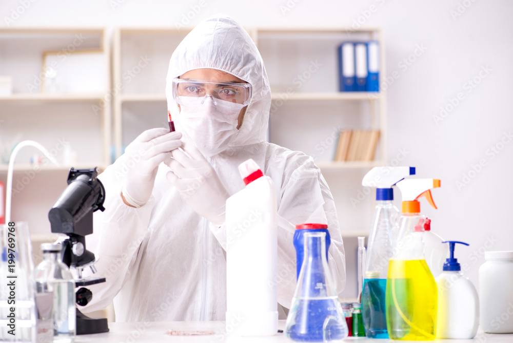 Chemist checking the quality of bathroom supplies Chemist checking the quality of bathroom supplies
