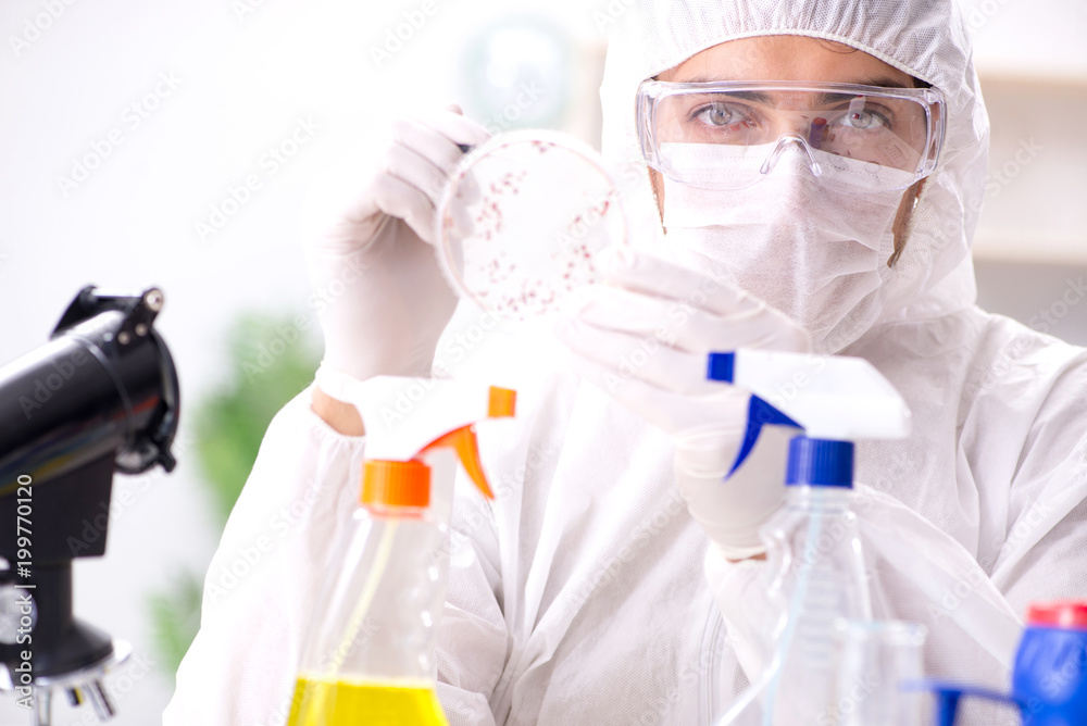 Chemist testing chemical substances in lab Chemist testing chemical substances in lab