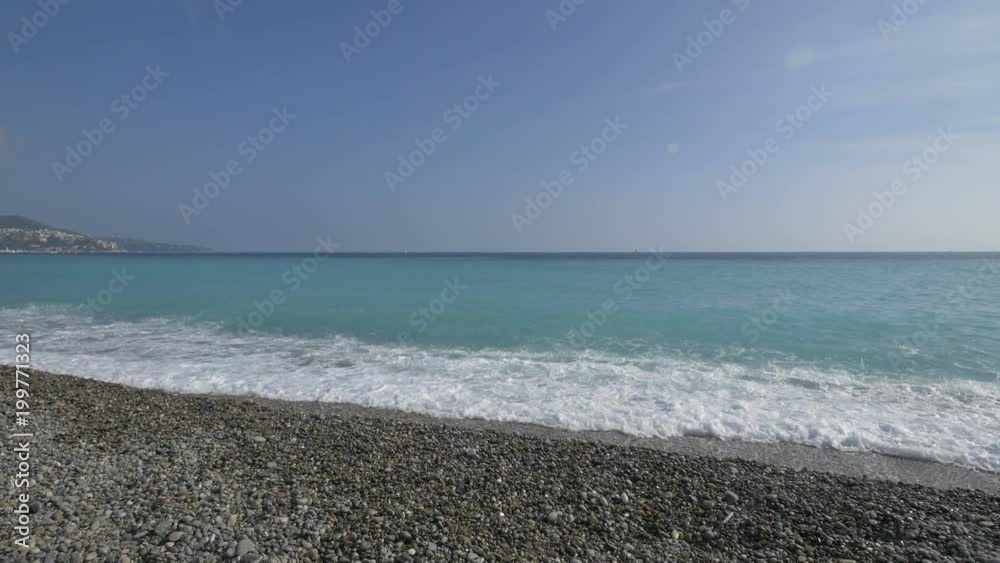 Waves crushing into a beach shore Waves crushing into a beach shore