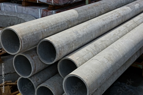 large gray long washed pipes in the heap