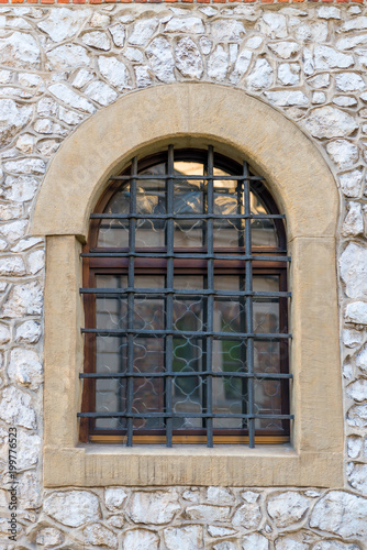 window with a medieval-style grille in the castle