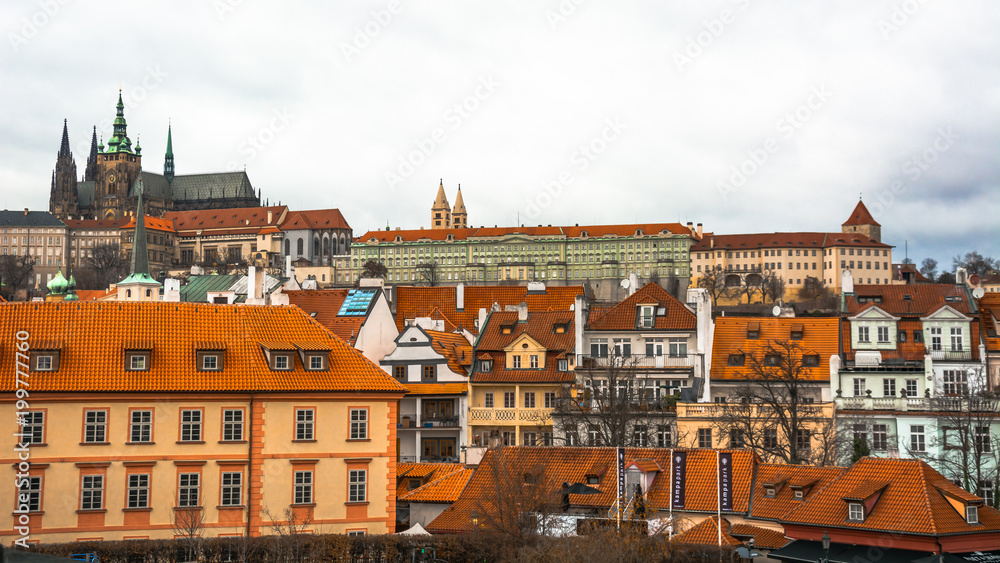 Obraz premium Prague / Czech - January 2 2018: Panorama of the city of Prague. The old part of the city. Beautiful roofs of shingles. Ancient buildings and churches.