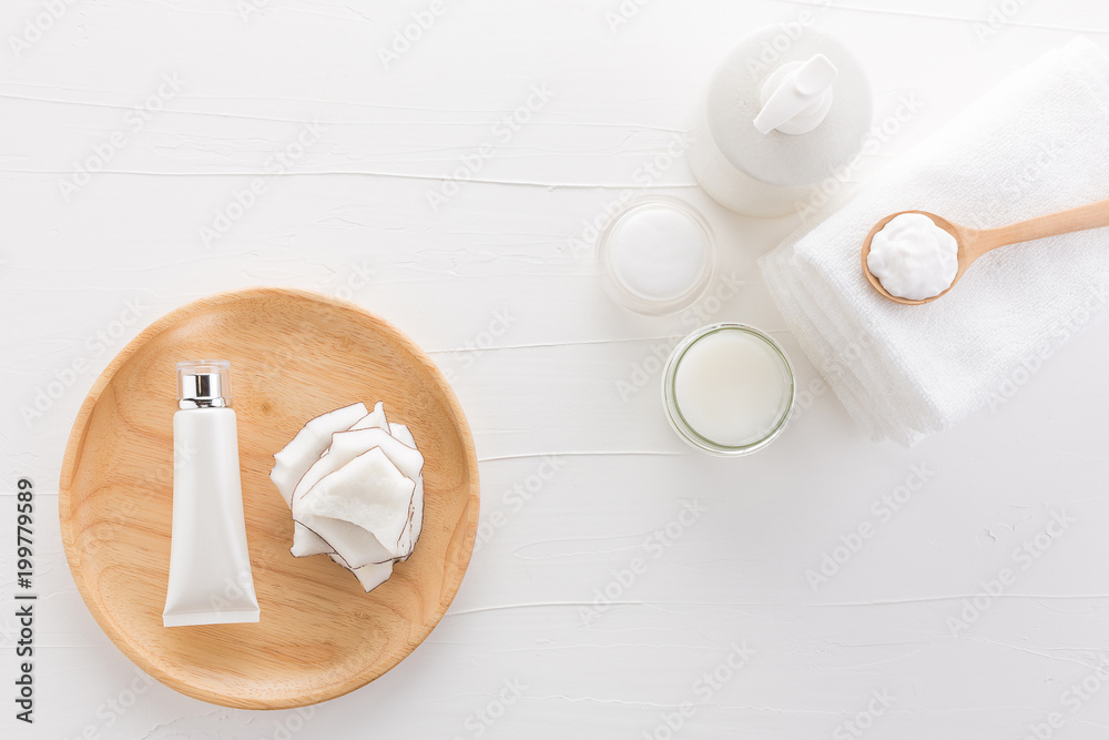 Fototapeta premium Homemade coconut products on white wooden table background from top view. Good for space and background.