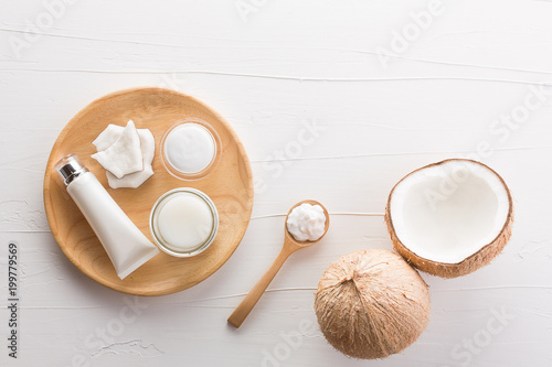 Homemade coconut products on white wooden table background from top view. Good for space and background.