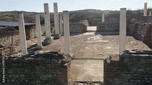 Slow tilt on temple hall columns of Felix Romuliana built by Roman Emperor Galerius. The construction started in 298 AD photo