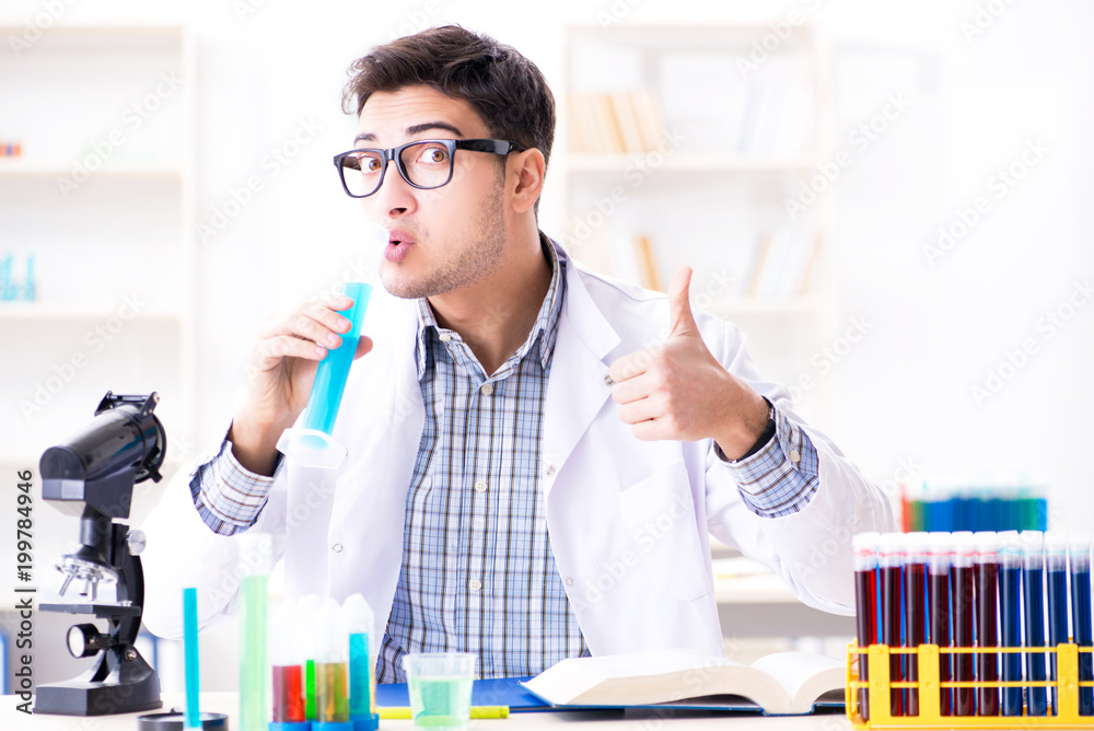 Chemistry student doing chemical experiments at classroom activi Chemistry student doing chemical experiments at classroom activi