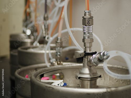 Steel beer keg at brewery of pub bar with tube