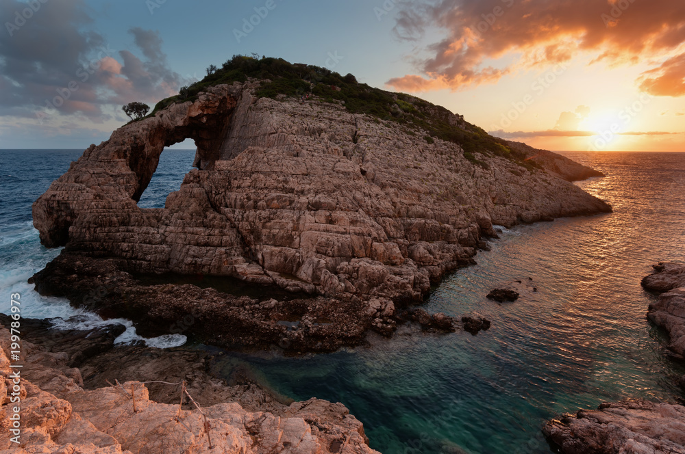 Landscape view of rocky formations Korakonisi in Zakynthos, Greece.Beautiful summer sunset, magnificent seascape.