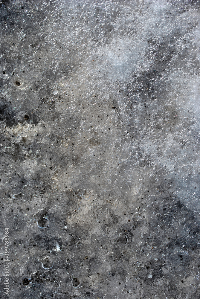 Obraz premium Melting snow background with dirt drops, vertical composition