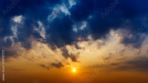 Tthe sun in the twilight sky and clouds