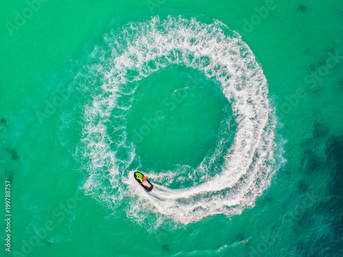 People are playing jet ski at sea during the holidays.Aerial view and top view. © MAGNIFIER