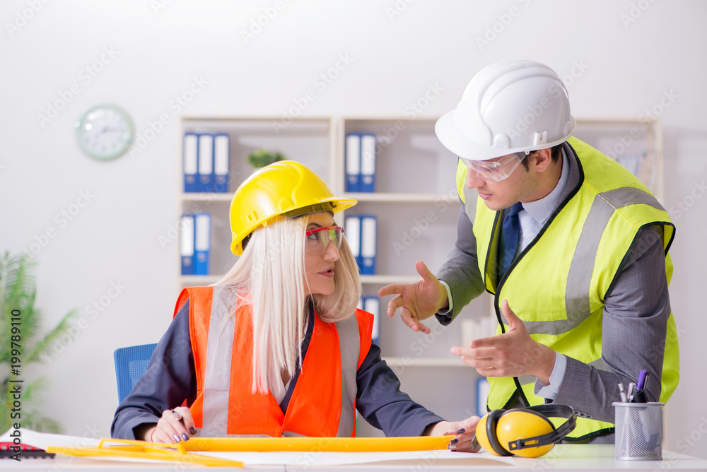 Construction workers having discussion in office before starting Construction workers having discussion in office before starting