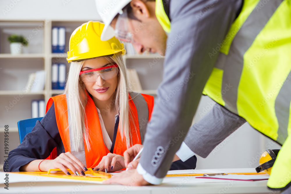 Construction workers having discussion in office before starting Construction workers having discussion in office before starting