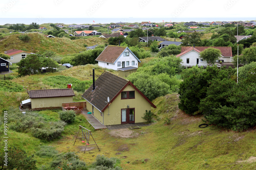 Typical scandinavian wooden house in Denmark. Island Fanoe. North Sea.