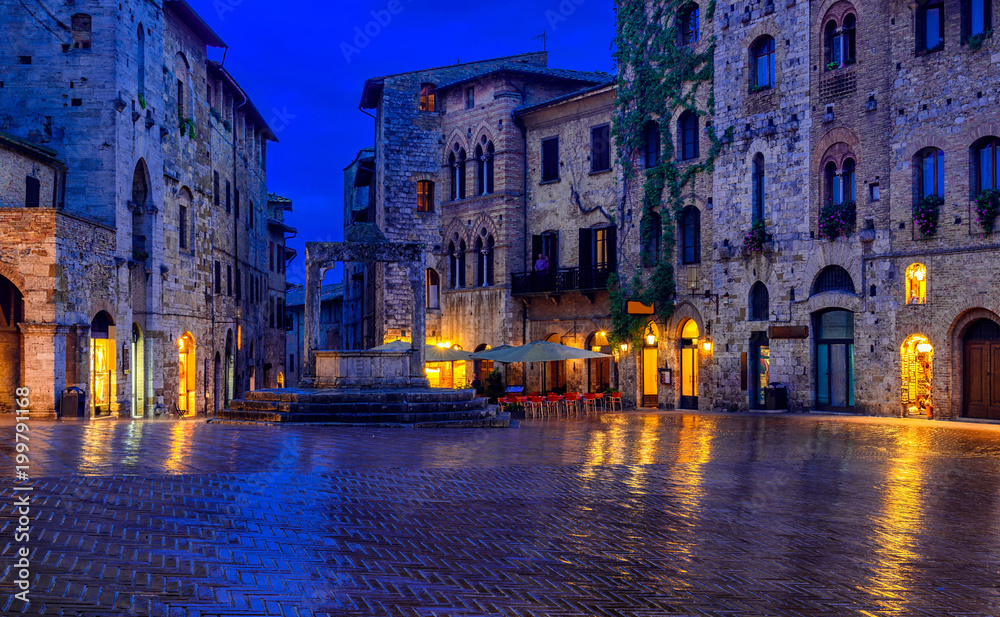 Night view of famous Piazza della Cisterna in the medieval town San Gimignano, Tuscany, Italy