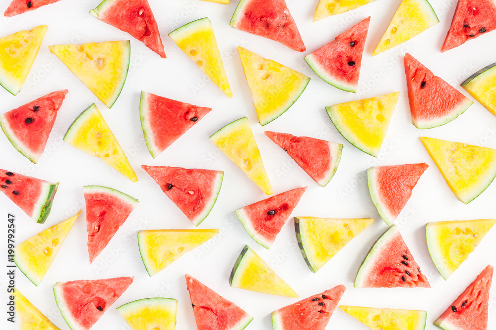 Watermelon pattern. Red and yellow watermelon on white background. Summer concept. Flat lay, top view Watermelon pattern. Red and yellow watermelon on white background. Summer concept. Flat lay, top view