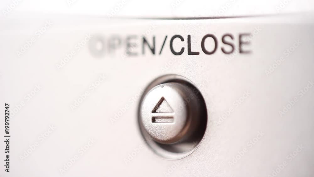 Pressing Open/Close button. Extreme close up Pressing Open/Close button. Extreme close up