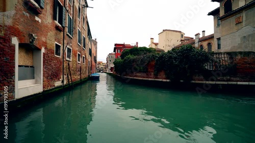 Venice Italy canal with no traffic green water and old houses 4K photo