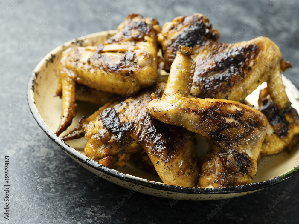 plate of barbecue chicken wing plate of barbecue chicken wing