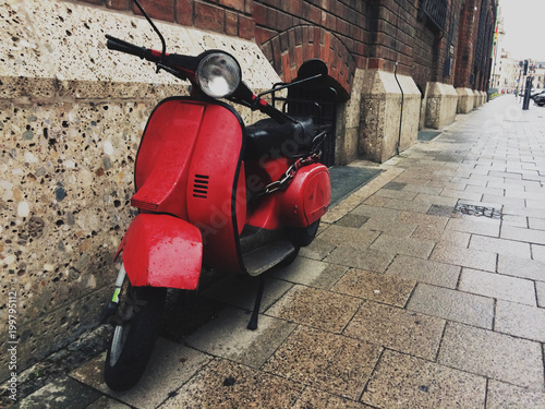Retro red scooter in street
