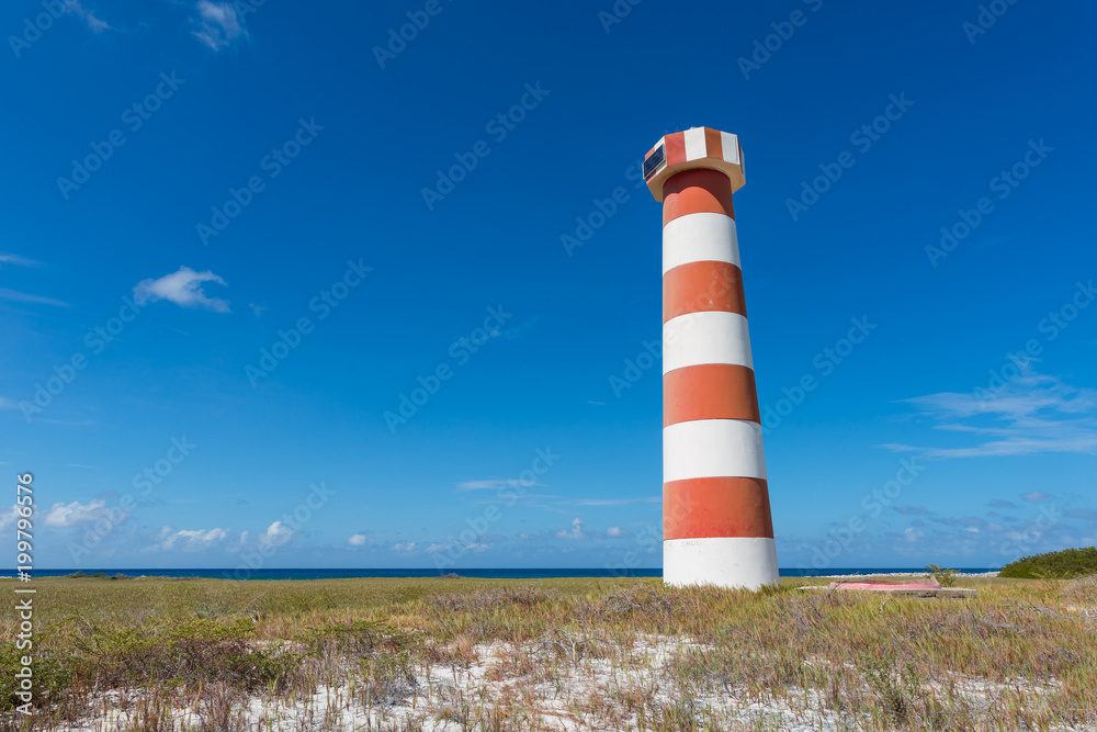 Red and white striped lighthouse at Water Cay, in Los Roques archipelago, Venezuela