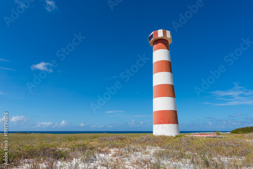 Red and white striped lighthouse at Water Cay  in Los Roques archipelago  Venezuela
