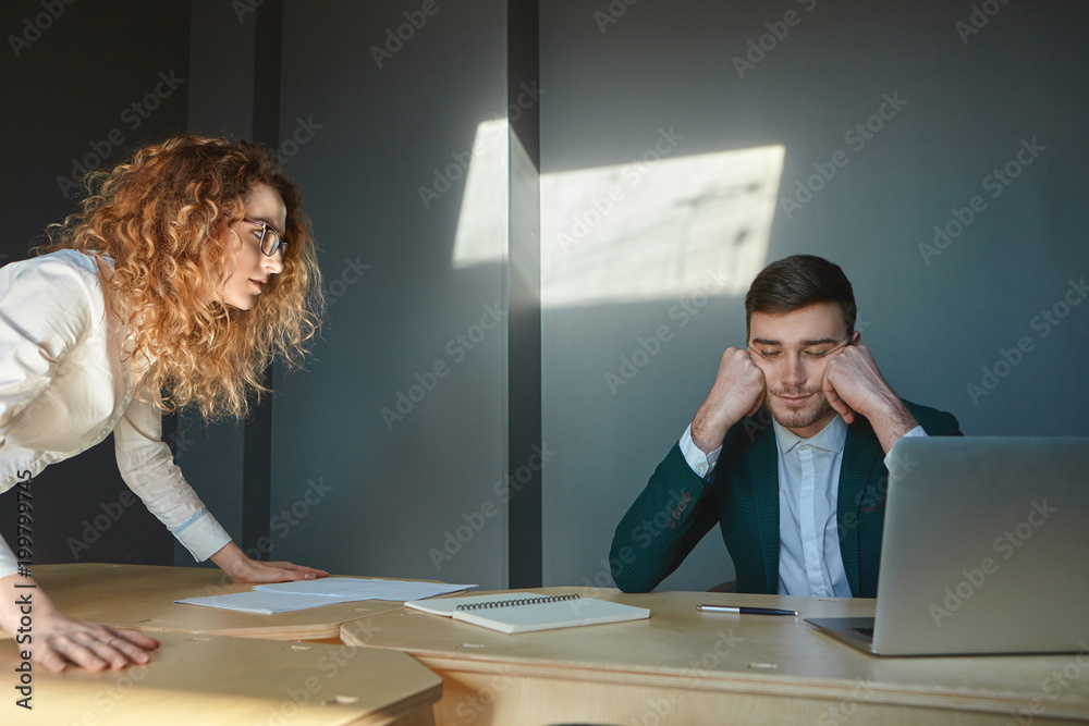 Cropped shot of angry disappointed young female boss in eyeglasses ...